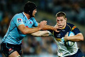 Michael Hooper (right) fends Dean Mumm.
Photo / Getty Images