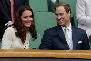 Britain's Prince William, right, and Kate, Duchess of Cambridge pictured at Wimbledon recently. Photos of the pair's honeymoon have been published by an Australian magazine. Photo / AP