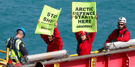 Actor Lucy Lawless and five Greenpeace activists are arrested by police on top of the derrick of an Arctic-bound Shell drillship in Port Taranaki, New Zealand. Photo / NZH