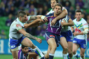 Maurice Blair of the Storm is challenged by Sandor Earl and David Shillington of the Raiders. Photo / Getty Images.