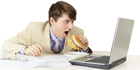 Office workers who eat at their desks may unwittingly be carrying out an extra 16 days' worth of work. Photo / Thinkstock