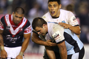 Anthony Tupou and Wade Graham of the Sharks react after their 14-14 draw with the Roosters. Photo / Getty Images
