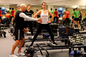 Pilates is controlled exercise using resistance from machines or your body. Photo / Getty Images