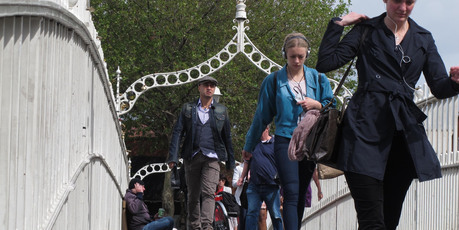A man begs on the Ha'penny Bridge in Dublin. With almost 15 per cent unemployment, many Irish have chosen to emigrate. Photo / AP