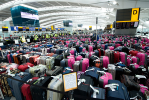 Heathrow has brought in an army of Olympic volunteers to deal with the volume of baggage and equipment coming into the country with the teams. Photo / AP