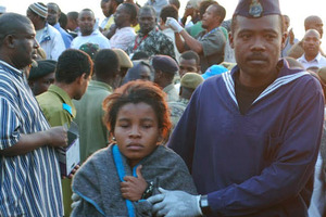 Wrapped in blankets survivors of the MV Karama Star Gate, ferry accident are brought into Malindi port in Zanzibar. Photo / AP