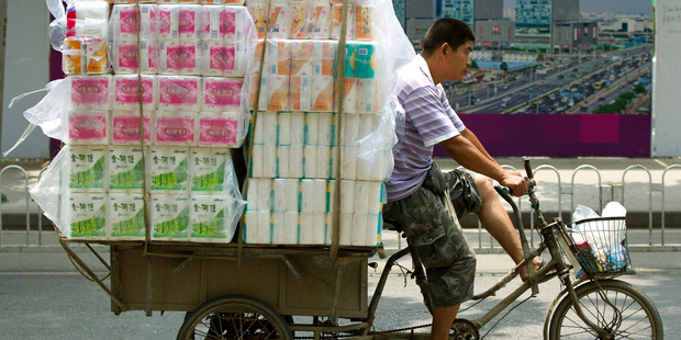 China's gross domestic product rose 7.6 per cent in the second quarter, the sixth straight slowdown. Photo / AP