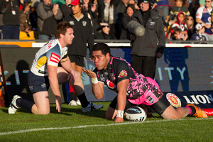Konrad Hurrell blows a kiss after scoring a try in the corner against the North Queensland Cowboys. Photo / AP.