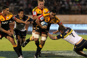 Liam Messam (with ball) shows the exciting style of rugby that has won the Chiefs many more fans this season. Photo / Alan Gibson