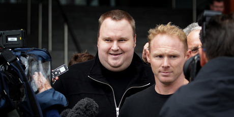 Kim Dotcom (left) leaves court earlier this year. Judge David Harvey, who has heard parts of the case, last week referred to the USA as the enemy in new trade talks. Photo / Sarah Ivey
