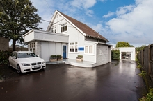 The larger building, was extensively upgraded in 2010, while the other property has California-style bungalow beginnings. 
