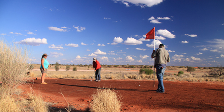 Residents of Cameron Corner play tri-state golf in Bourke. Photo / Fergus Blakiston