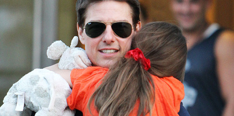 Tom Cruise holds his daughter Suri during a visit in New York. Photo / AP