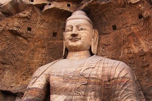 Buddhas survey their kingdom from windows carved out of sandstone. Photo / Jacqueline Smith