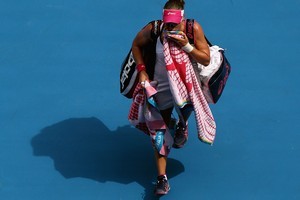 Samantha Stosur of Australia walks off Rod Laver Arena after losing her first round match against Sorana Cirstea of Romania. Photo / Getty Images