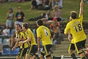 Emmanuel Muscat of the Phoenix celebrates with teammates after scoring. Photo / Getty Images