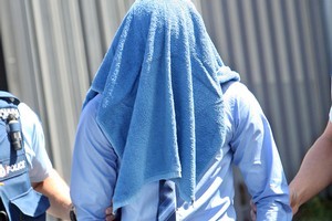The 16-year-old is led from court yesterday after admitting that he sexually violated the little girl, a visitor to New Zealand, in a caravan in a Turangi campground. Photo / APN