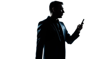 business traveler man walking with telephone and suitcase