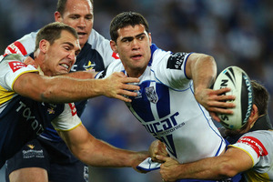 Dale Finucane of the Bulldogs looks to offload during the round 21 NRL match between the Canterbury Bulldogs and the North Queensland Cowboys. Photo / Getty Images.