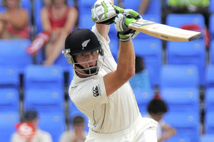 New Zealand's Martin Guptill, plays a shot off West Indies' bowler Ravi Rampaul, unseen, during the opening day of their first cricket Test match. Photo / AP