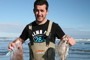 Leon Vaudrey is delighted with his snapper and gurnard caught off Muriwai Beach.
Photo / Geoff Thomas