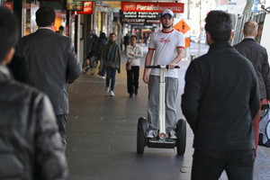 Artur Pelanda delivers pizza on a Segway. Photo / Michael Craig