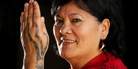 Doctoral student Mei Winitana, whose ta moko incorporates a puwerewere, or spider's web pattern, says some women are adding to their designs over time. Photo / Alan Gibson