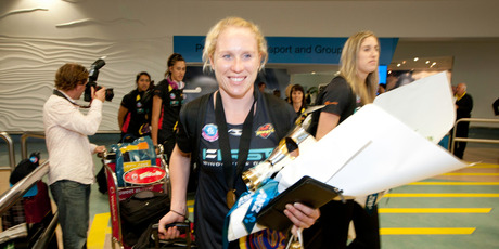 Laura Langman, captain of the Waikato Bay of Plenty Magic, had a triumphant arrival at Auckland Airport yesterday. Photo / Richard Robinson