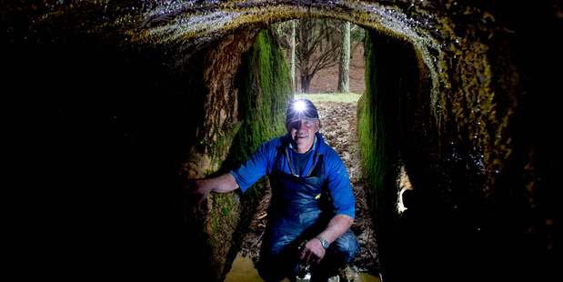 Evan Smeath stands in an old gold mine shaft on his property. Mining may return to the Northland property. Photo / Steven McNicholl