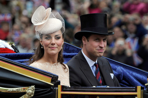 The Duke and Duchess of Cambridge pass along The Mall as part of a four-day Diamond Jubilee celebration. Photo / AP