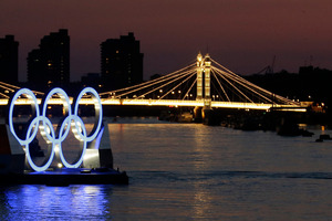 The Olympic rings floating on the Thames. Photo / AP.