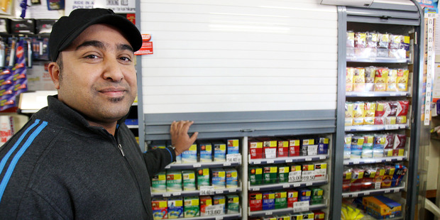 The new tobacco laws mean retailers such as Farrukh Khen at Lenz Superette in Cameron Rd, Tauranga, can't display cigarettes any more. Photo / APN