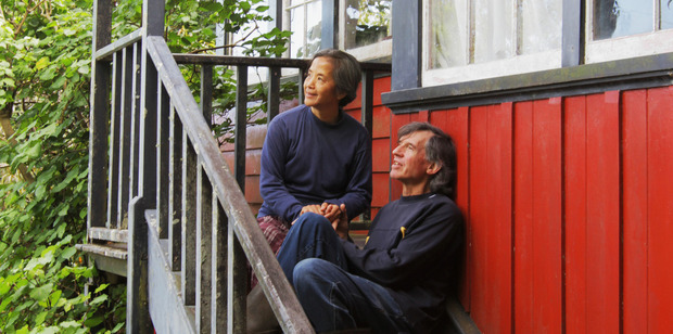 Alyx Duncan's parents Lee and Jia on the steps of The Red House. Photo / Supplied