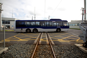 A bus travels over an Onehunga railway crossing on Wednesday. A driver was suspended after she stalled on the crossing on Monday. Picture / Dean Purcell