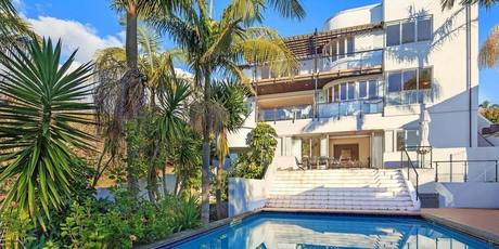 Several renovations around the pool and interior of the Marine Parade house do not meet building standards and the garage has no code of compliance certificate. Photo / Supplied