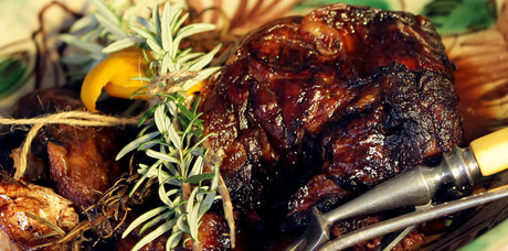 Slow cooked lamb shoulder with red wine and rosemary. Photo / Michael Craig