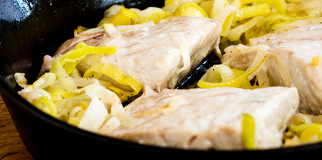 Roast hapuku and leeks with peas and beurre blanc. Photo / Babiche Martens