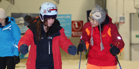 Snowplanet instructor Ashleigh (left) teaches Trang Dai basic ski moves. Photo / Doug Sherring