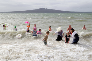 Many brave souls jumped into the sea yesterday at the Pirates of the Caribbean-themed Winter Splash at Mission Bay in Auckland. Photo / Richard Robinson