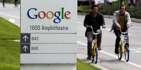 Google workers ride bikes outside of Google headquarters in Mountain View, California. Google has bought NZ-founded Wildfire company. Photo / AP