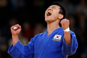 South Korea's Cho Jun-ho celebrates before the decision was reversed. Photo / AP.