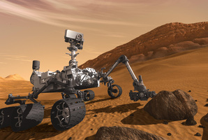 The Mars Science Laboratory Curiosity rover examines a rock on Mars. Photo / AP