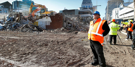 Earthquake Recovery Minister Gerry Brownlee watches Christchurch demolition work. Photo / Jarrod Booker
