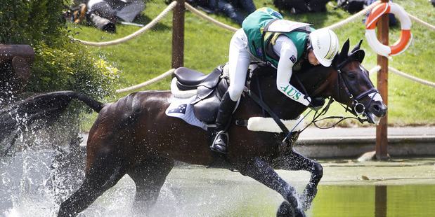 Australia's Sam Griffiths struggles to stay on her horse Happy Times at water jumps during the individual eventing cross country. Photo / Mark Mitchell