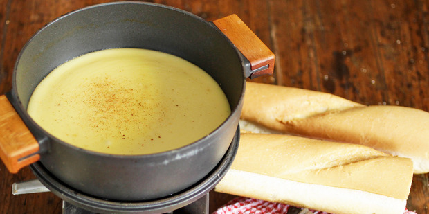 The fun comes when it's time to eat cheese fondue. Try a mixture of chopped vegetables and crusty bread. Get inventive with your dipping selections if you'd like. Photo / Michael Craig