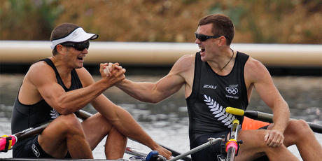 Nathan Cohen, left and Joseph Sullivan celebrate after winning a gold medal in the men's double scull. Photo / Mark Mitchell