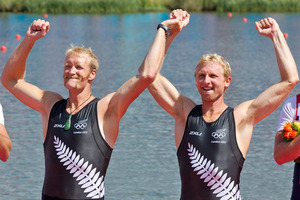 Eric Murray and Hamish Bond celebrate their gold medal on the podium at the London Olympics. Source / Brett Phibbs NZ Herald