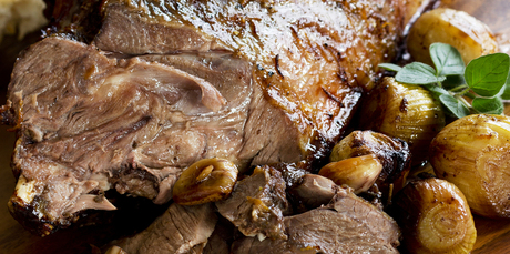 Roast goat leg with garlic and marjoram. Photo / Babiche Martens