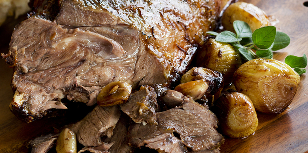 Roast goat leg with garlic and marjoram. Photo / Babiche Martens