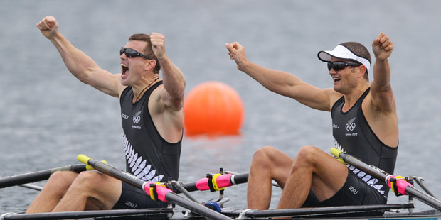 Nathan Cohen and Joeseph Sullivan celebrate after crossing the line to win Olympic gold. Photo / Brett Phibbs